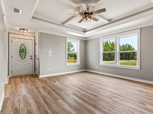 1613 Sea Breeze Way, Carrabelle, FL 32322 - unfurnished living room featuring ceiling fan with notable chandelier, visible vents, light wood-style floors, and ornamental molding