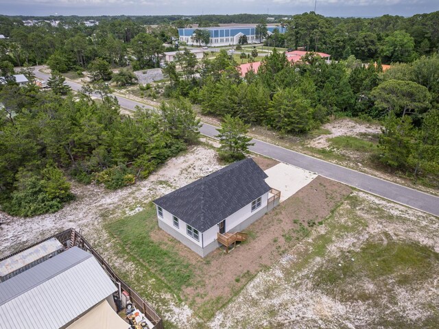 1613 Sea Breeze Way, Carrabelle, FL 32322 - unfurnished living room with crown molding, a sink, a ceiling fan, wood finished floors, and baseboards