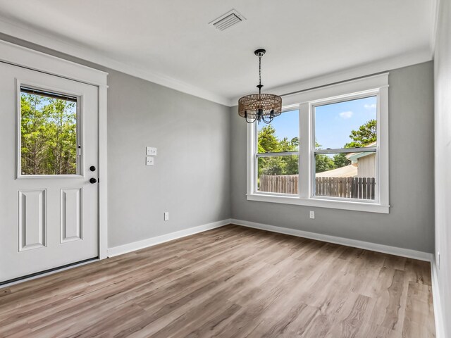 1613 Sea Breeze Way, Carrabelle, FL 32322 - kitchen featuring wainscoting, gray cabinets, appliances with stainless steel finishes, and crown molding