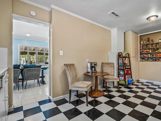 dining area featuring crown molding