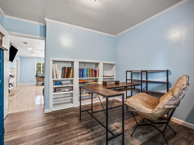 home office featuring wood-type flooring and ornamental molding