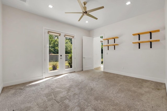 empty room with carpet flooring, ceiling fan, and french doors