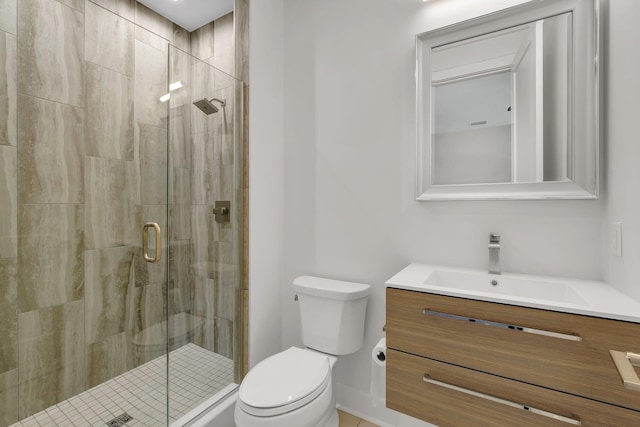 bathroom with vanity, toilet, and walk in shower