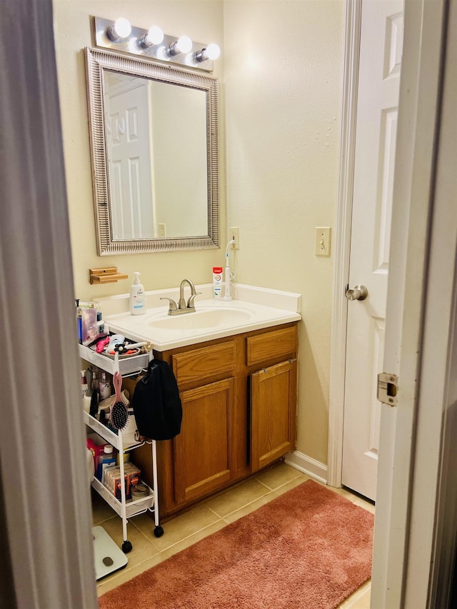 bathroom with tile patterned flooring and vanity