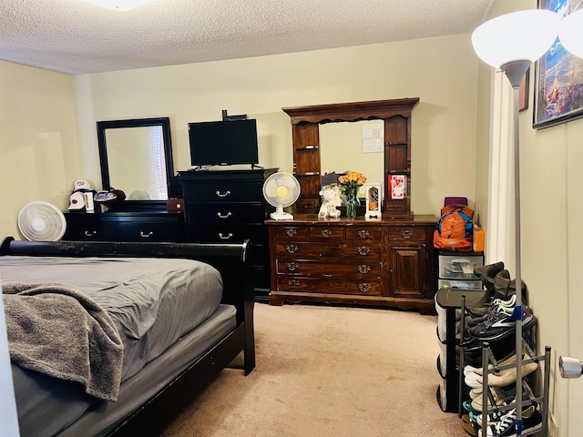 carpeted bedroom with a textured ceiling