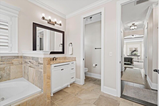 6476 Tracy Ln, Tallahassee, FL 32309 - bedroom with dark wood-style floors, ornamental molding, a ceiling fan, and baseboards