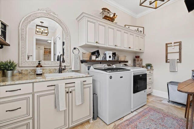 6476 Tracy Ln, Tallahassee, FL 32309 - laundry room featuring crown molding, independent washer and dryer, cabinet space, a chandelier, and baseboards