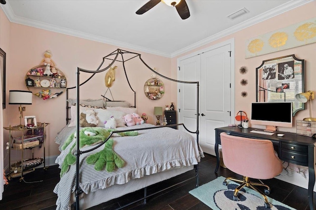 6476 Tracy Ln, Tallahassee, FL 32309 - bedroom with crown molding, wood finished floors, a ceiling fan, an office area, and a closet