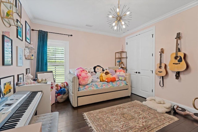 6476 Tracy Ln, Tallahassee, FL 32309 - bedroom featuring a chandelier, ornamental molding, dark wood-type flooring, and a closet