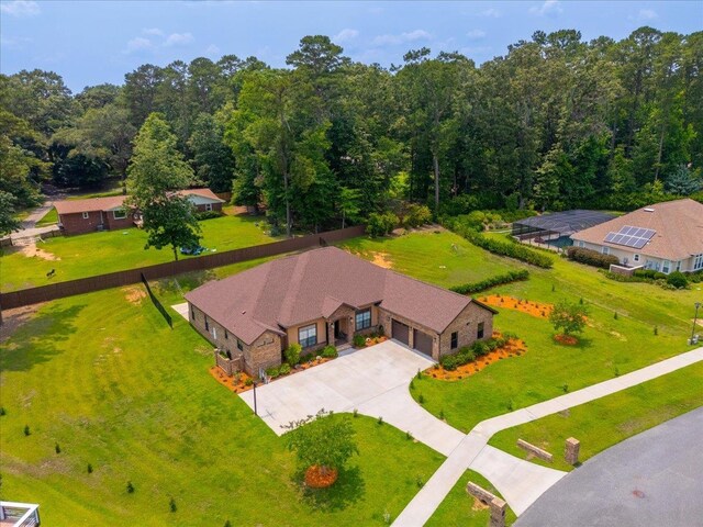 6476 Tracy Ln, Tallahassee, FL 32309 - view of front of property with a front yard and an attached garage