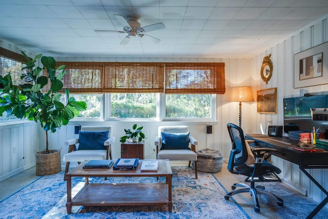 office area with ceiling fan, plenty of natural light, and carpet flooring