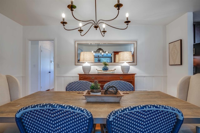 dining space with a chandelier