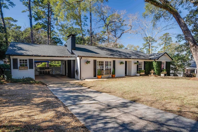 single story home featuring a carport