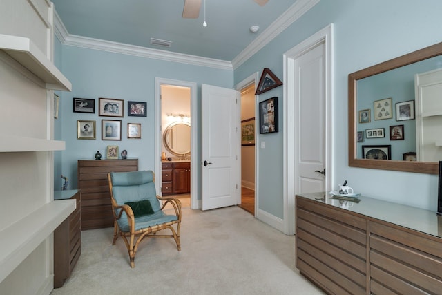 living area featuring ornamental molding, light carpet, and ceiling fan