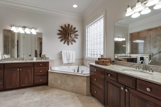 bathroom with tile patterned floors, vanity, crown molding, and shower with separate bathtub