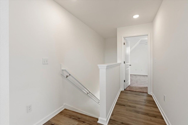 hallway with hardwood / wood-style flooring