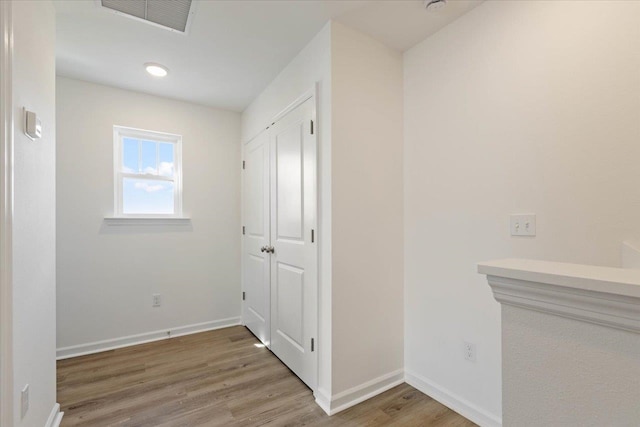 hall featuring wood-type flooring