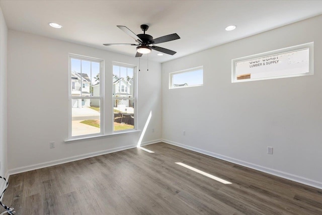 spare room with wood-type flooring and ceiling fan