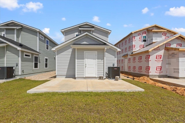 back of house featuring a patio area, a yard, and cooling unit