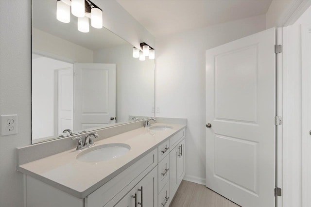 bathroom featuring vanity and wood-type flooring