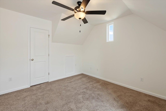 bonus room with lofted ceiling, light carpet, and ceiling fan