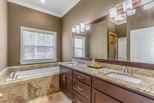 bathroom with tiled bath, vanity, and ornamental molding