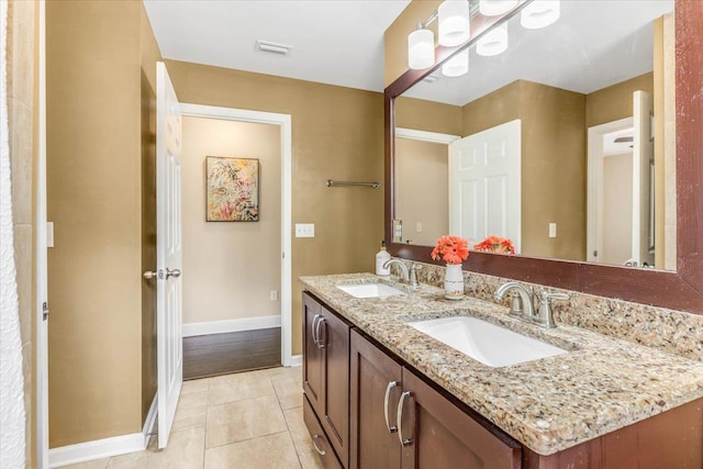 bathroom featuring tile patterned floors and vanity