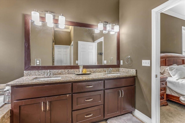 bathroom with vanity and ornamental molding