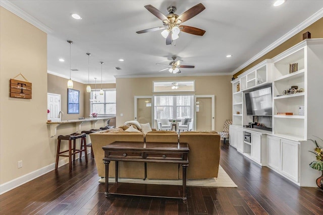 living room with ornamental molding and dark hardwood / wood-style floors