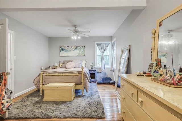 bedroom featuring a ceiling fan and light wood-type flooring