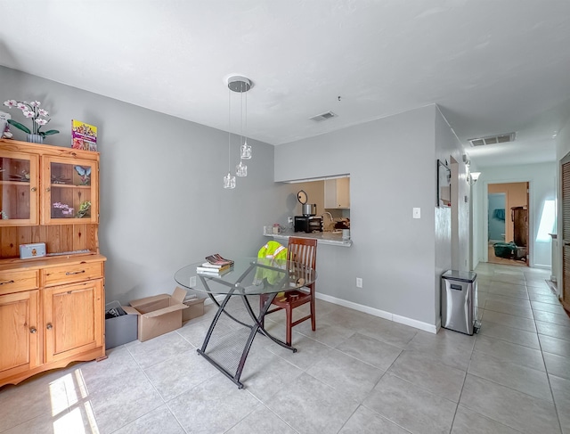 1319 Airport Dr Unit F04, Tallahassee, FL 32304 - dining room with light tile patterned flooring and a chandelier