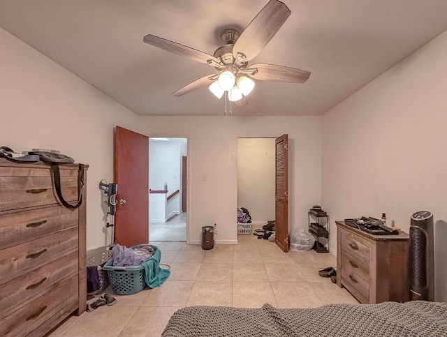 1319 Airport Dr Unit F04, Tallahassee, FL 32304 - bedroom with light tile patterned floors, a ceiling fan, a closet, and baseboards