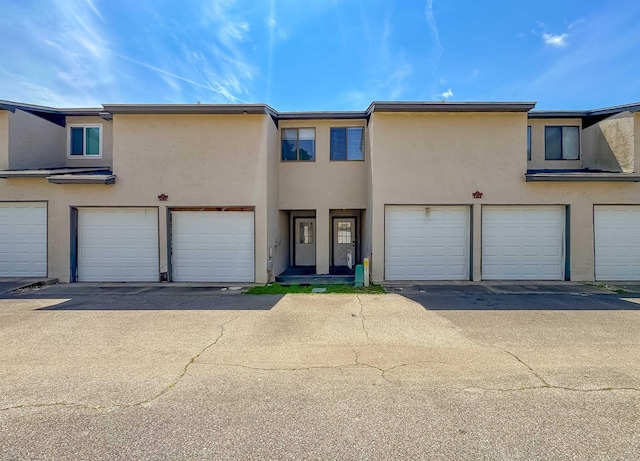 1319 Airport Dr Unit F04, Tallahassee, FL 32304 - townhome / multi-family property with stucco siding and a garage