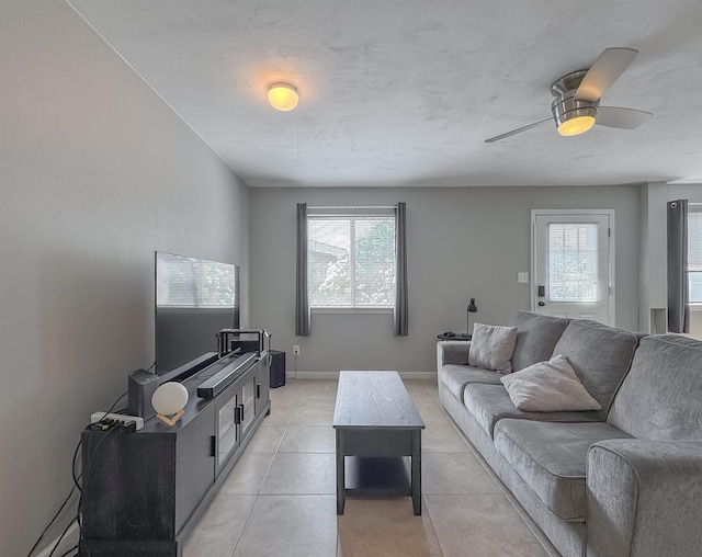 1319 Airport Dr Unit F04, Tallahassee, FL 32304 - living room featuring healthy amount of natural light, light tile patterned floors, baseboards, and a ceiling fan