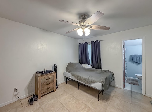 1319 Airport Dr Unit F04, Tallahassee, FL 32304 - bedroom featuring ceiling fan, baseboards, light tile patterned floors, and connected bathroom