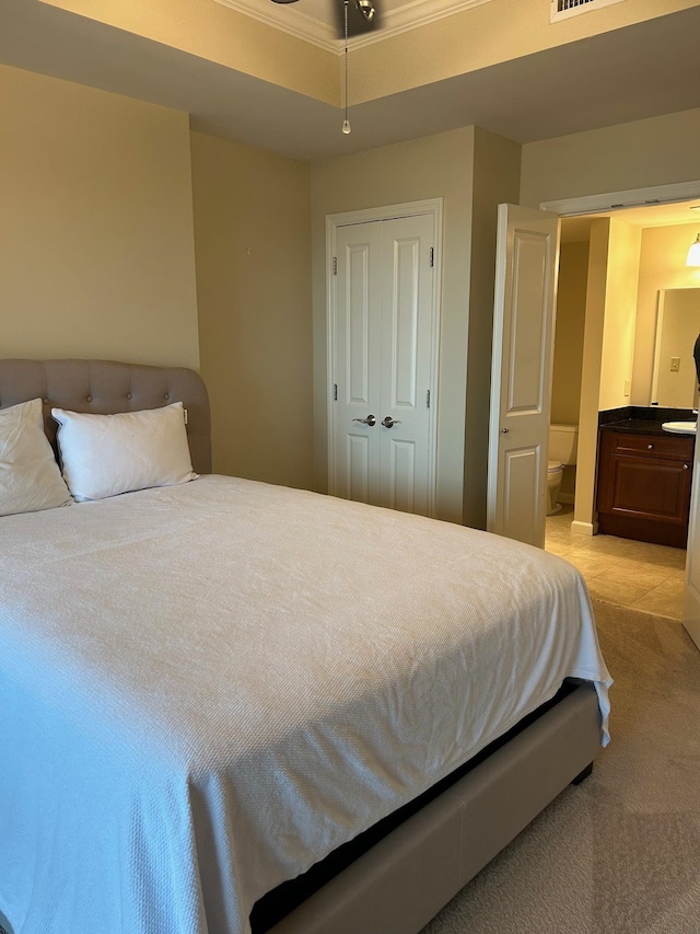 121 N Monroe St Unit 8007, Tallahassee, FL 32301 - bedroom with light colored carpet, a closet, and ensuite bathroom