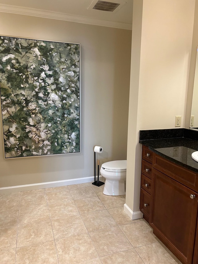 121 N Monroe St Unit 8007, Tallahassee, FL 32301 - bathroom with vanity, toilet, crown molding, baseboards, and tile patterned floors