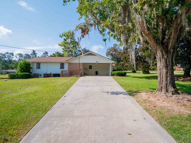 ranch-style home featuring a front yard and a carport