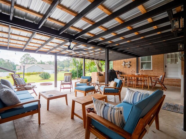 view of patio featuring ceiling fan, a pergola, and an outdoor living space