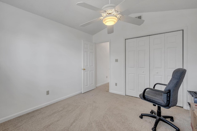 home office featuring light carpet, lofted ceiling, and ceiling fan