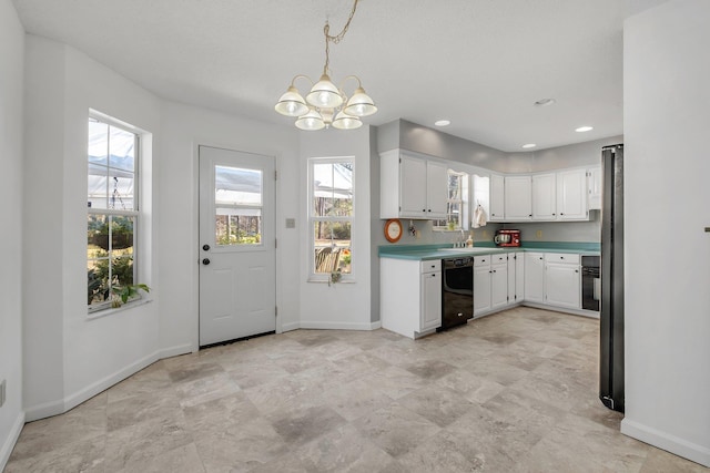 kitchen with white cabinetry, a wealth of natural light, and black appliances