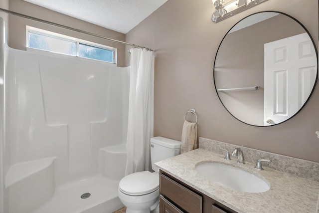 bathroom with vanity, toilet, a textured ceiling, and a shower with curtain