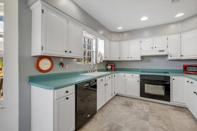 kitchen featuring sink, black appliances, and white cabinets