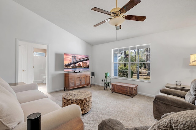 carpeted living room featuring vaulted ceiling and ceiling fan