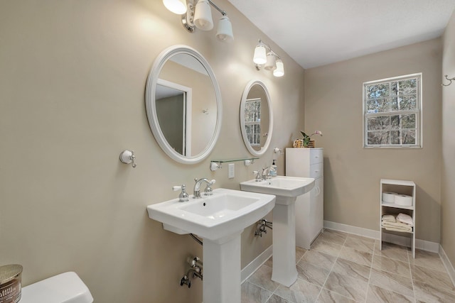 bathroom featuring double sink