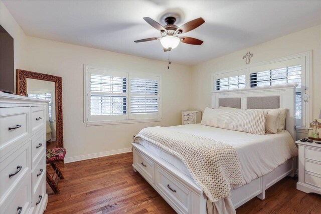 818 Watt Dr, Tallahassee, FL 32303 - bedroom with dark wood-style floors, ceiling fan, and baseboards