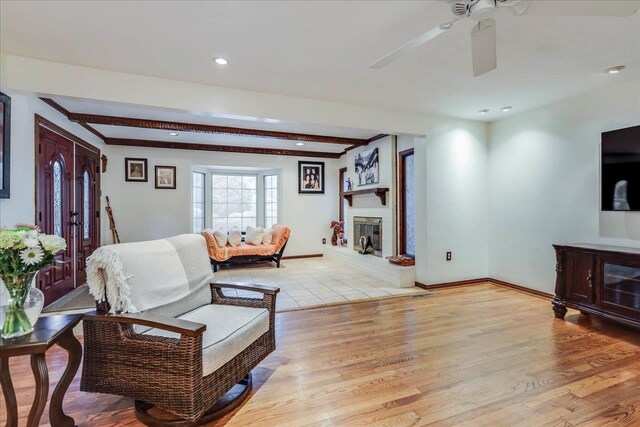 818 Watt Dr, Tallahassee, FL 32303 - living area with light wood-type flooring, a fireplace, baseboards, and recessed lighting
