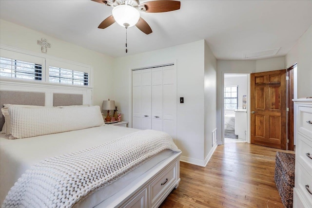 818 Watt Dr, Tallahassee, FL 32303 - bedroom featuring light wood-style floors, multiple windows, baseboards, and a closet