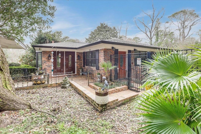 818 Watt Dr, Tallahassee, FL 32303 - rear view of property with brick siding
