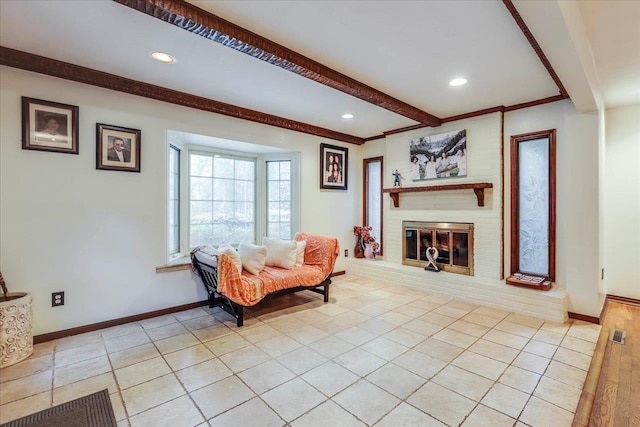 818 Watt Dr, Tallahassee, FL 32303 - living area featuring light tile patterned floors, a fireplace, beam ceiling, and baseboards